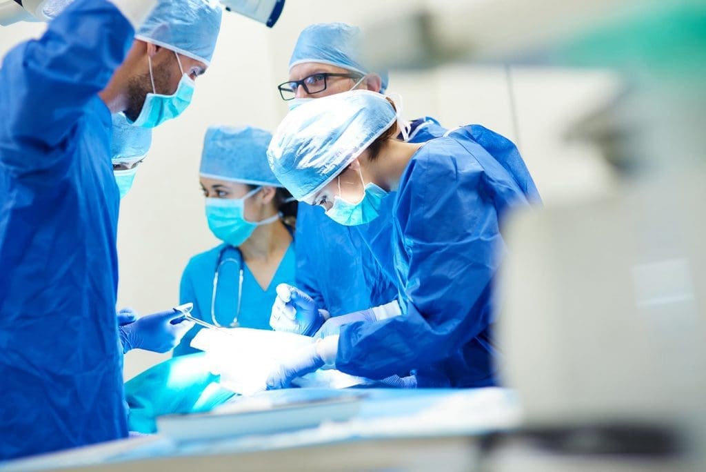 Eye surgeons working on a patient