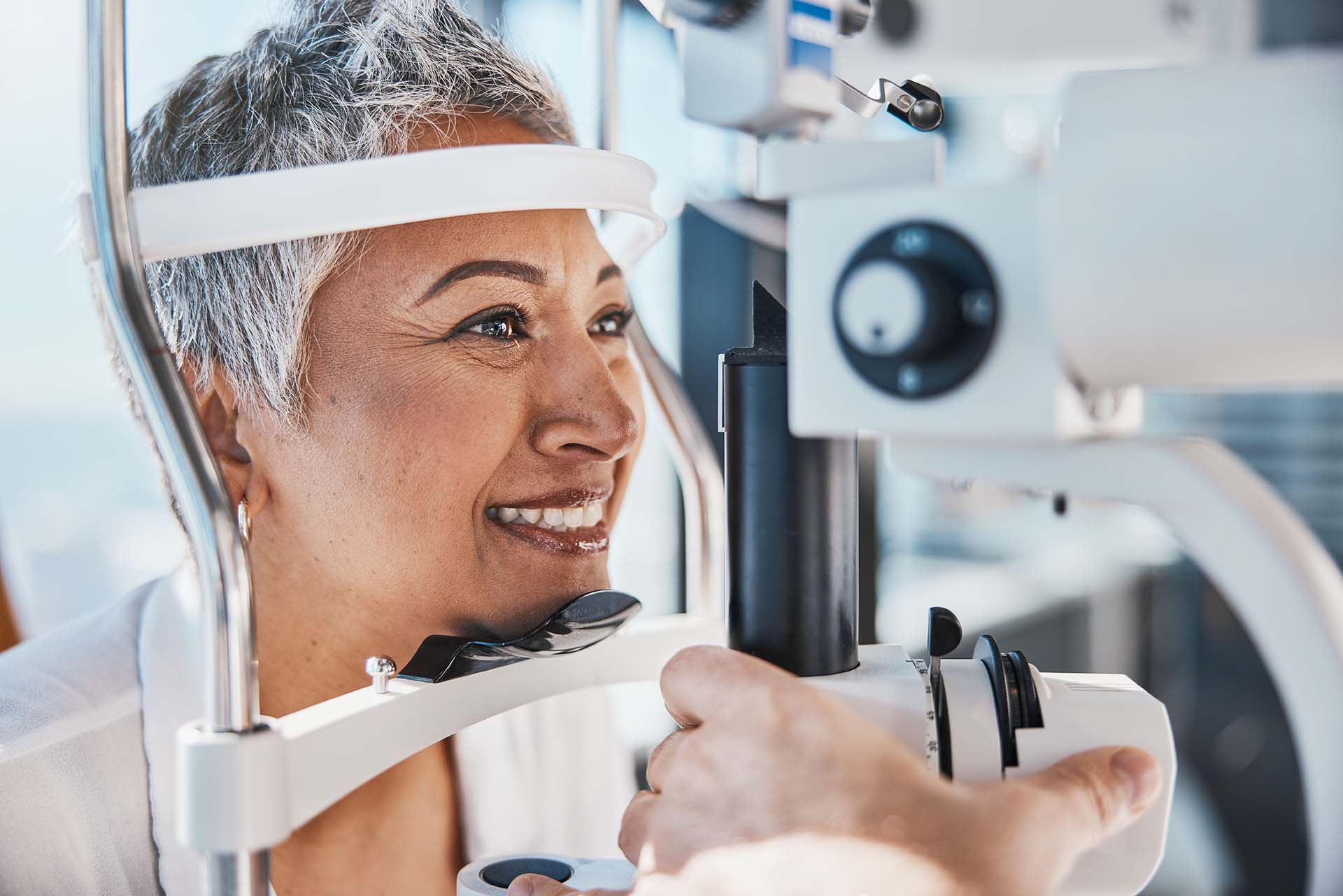 happy woman getting an eye exam